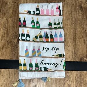 Anthropology Sip Sip Hooray" champagne-themed kitchen towel with tassels